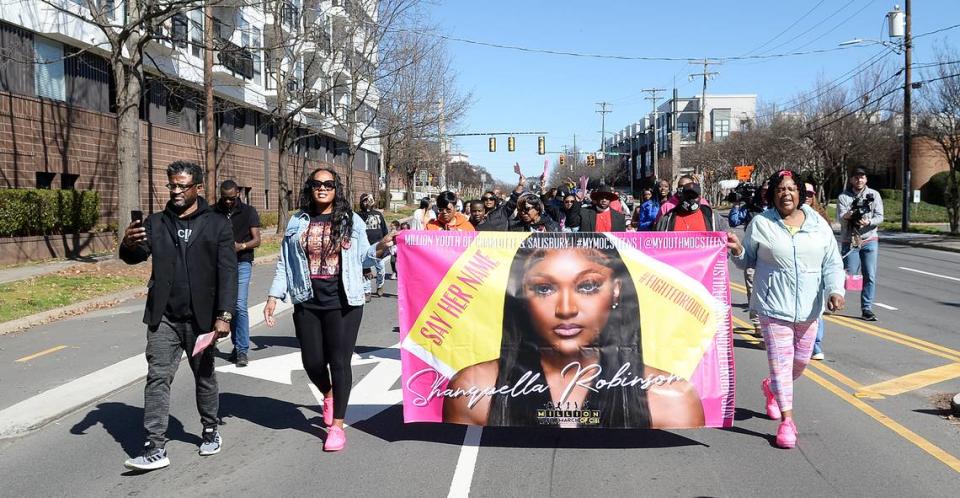 Several dozen activists and the family of Shaquella Robinson marched from Little Rock A.M.E. Zion Church to a nearby Charlotte post office on North McDowell Street to send 1,000 letters in pink envelopes to Mexican officials, demanding justice on Saturday, Feb. 18, 2023.