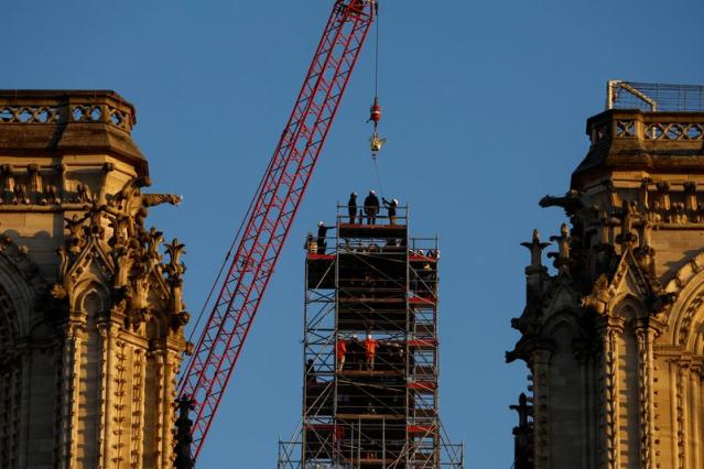 New golden rooster weathervane installed atop Notre Dame Cathedral spire -  CBS News