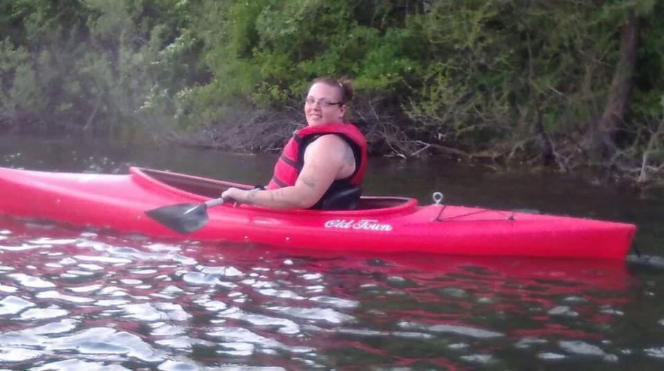 An undated photo shows Catherine Minix on a kayaking trip with a friend.