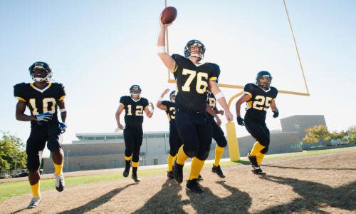 Football players celebrating sportsball