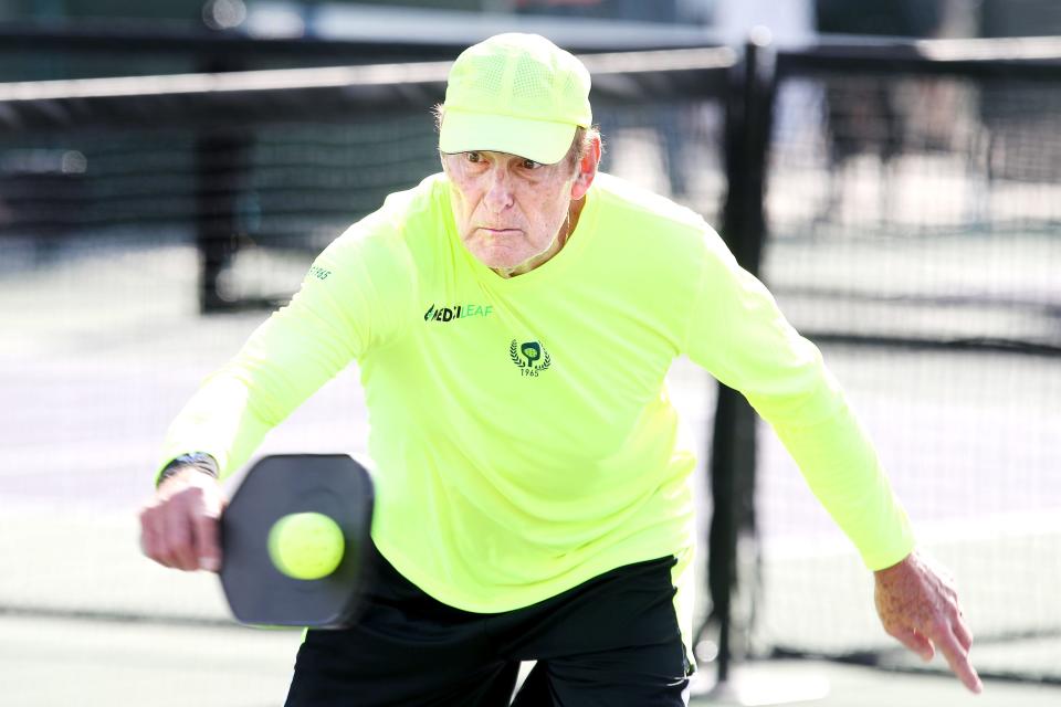 Basketball Hall of Famer Rick Barry returns the ball during the Margaritaville USA Pickleball National Championships at the Indian Wells Tennis Garden in Indian Wells, Calif., on December 13, 2021. 