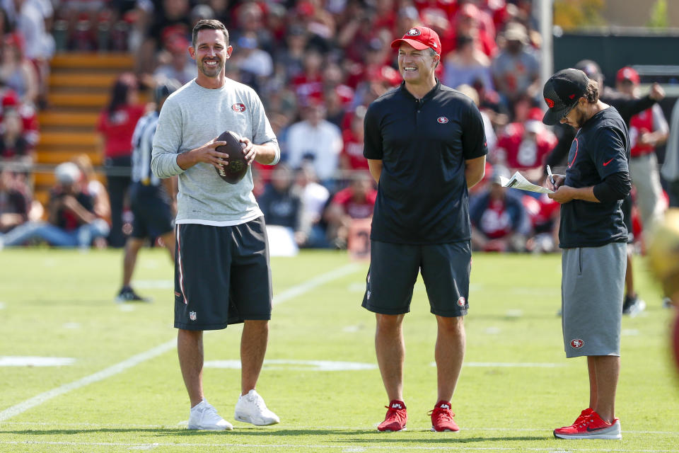 Niners general manager John Lynch (middle) appears to have missed badly in the first round of the 2017 NFL draft. (AP)