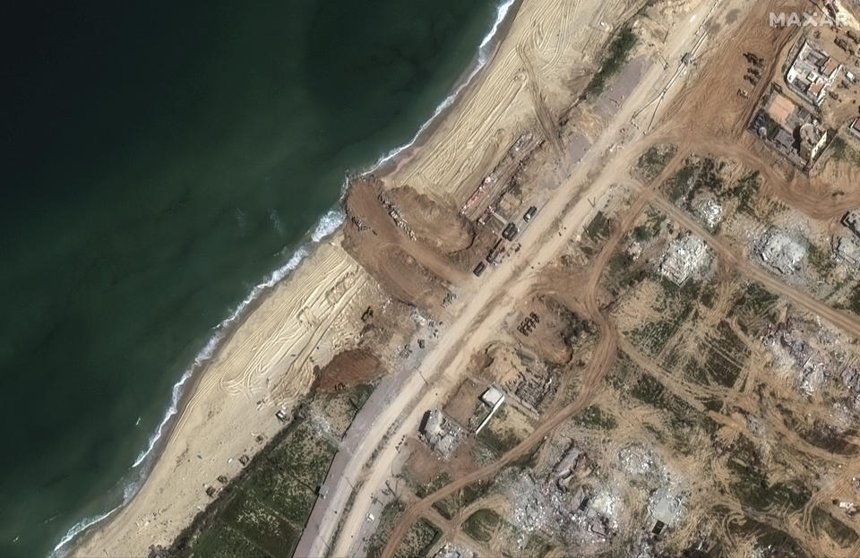 This satellite image released by Maxar Technologies on Thursday, March 14, 2024 shows a new jetty is under construction on the Gaza coastline just south of Gaza City on Tuesday, March 12, 2024. (Satellite image ©2024 Maxar Technologies, via AP)