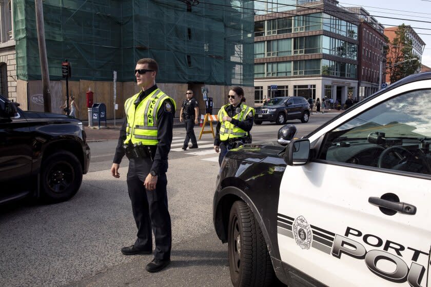 Portland police close Commercial Street from Pearl to Franklin to traffic just after 4:30 p.m. on Wednesday, July 13, 2022. Multiple streets in Portland's downtown district and along its congested waterfront will be temporarily closed to traffic during the National Governor's Association summer conference being held in the city. (Brianna Soukup/Portland Press Herald via AP)