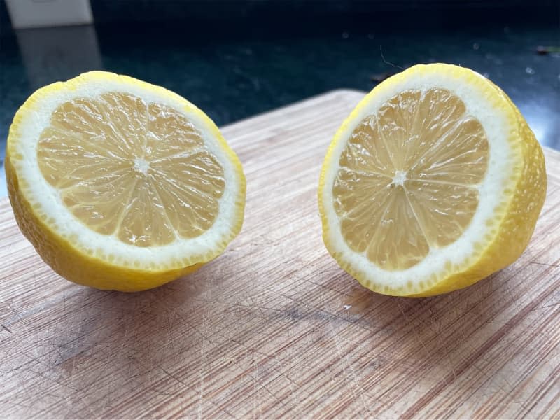 Seedless lemon cut in half.