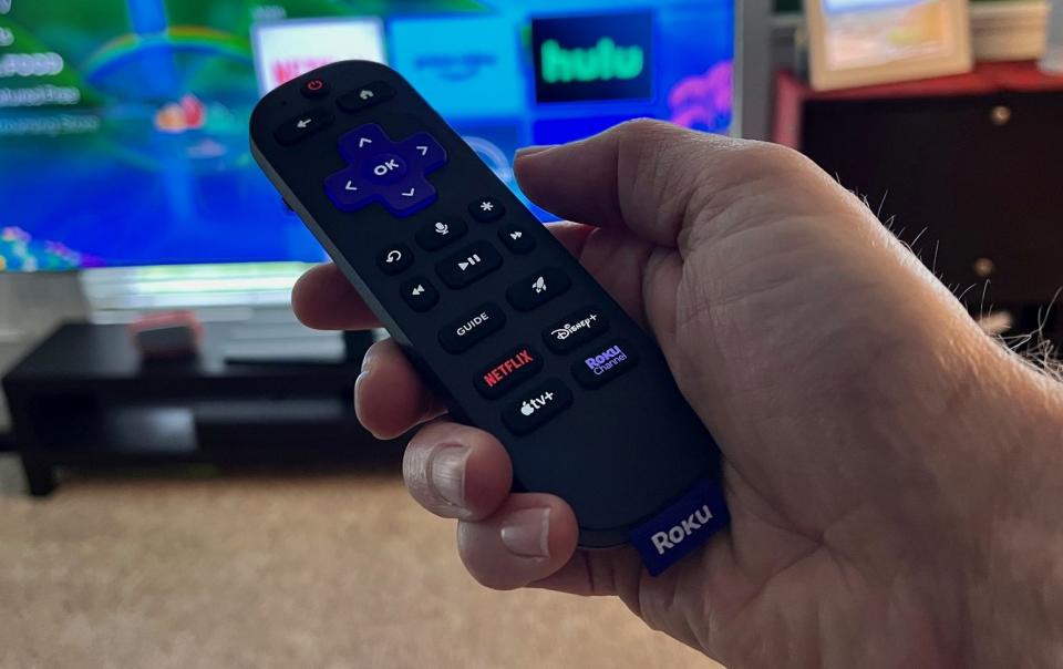 A close-up of the Roku Voice Remote Pro with its buttons lit up. (Rick Broida/Yahoo News)