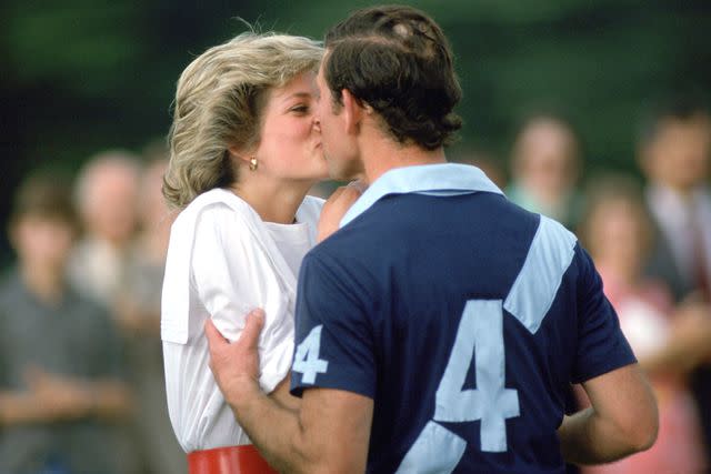 <p>Tim Graham Photo Library/Getty</p> Princess Diana and Prince Charles share a kiss on the polo pitch in June 1985.