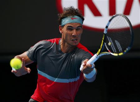 Rafael Nadal of Spain hits a return to Kei Nishikori of Japan during their men's singles match at the Australian Open 2014 tennis tournament in Melbourne January 20, 2014. REUTERS/Petar Kujundzic