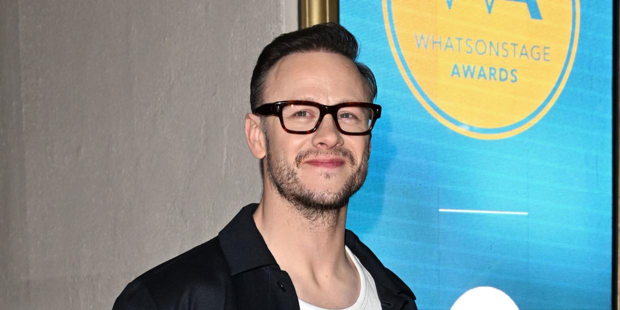 kevin clifton wears high heels at the whatsonstage awards