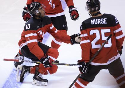 Canada&#39;s Anthony Duclair celebrate his goal against Russia next to teammate Darnell Nurse during the first period of the title game at the hockey World Junior Championship in Toronto on Monday, Jan. 5, 2015. (AP Photo/The Canadian Press, Nathan Denette)