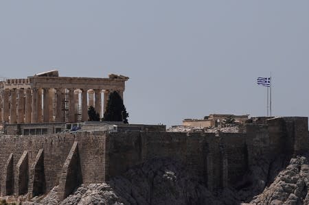 The Parthenon temple is seen without visitors as high temperatures prompted authorities to close the Acropolis archaeological site in Athens