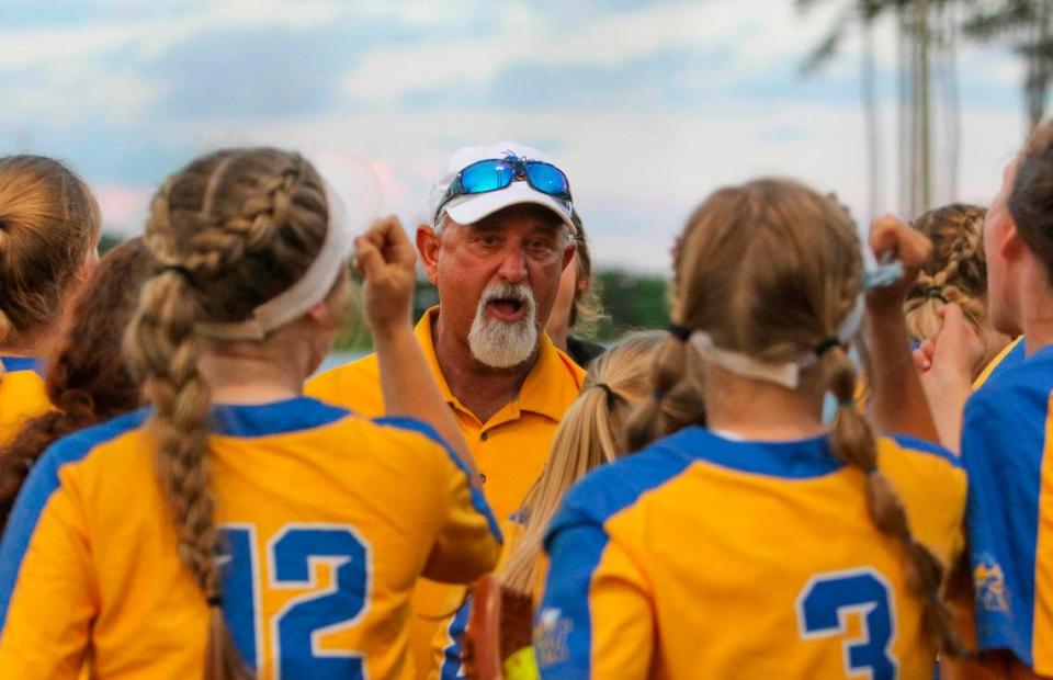 Fort Mill coach Chuck Stegall talks to his players during the class 5A softball championship against Lexington at Blythewood High on Friday, May 27, 2022.