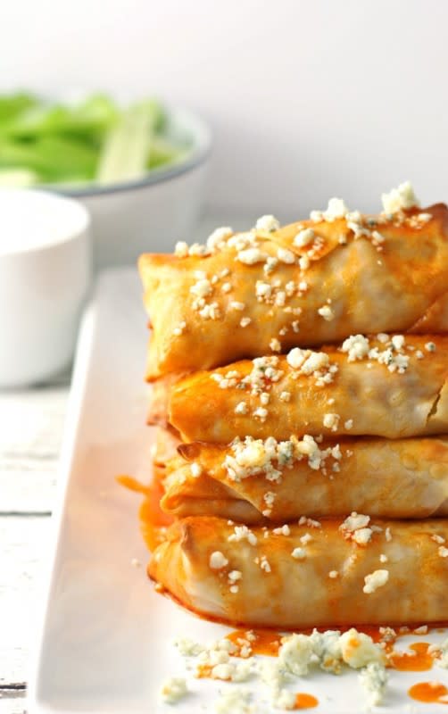 <p>Honey and Birch</p><p>The best way to serve these spicy buffalo stuffed rolls? With a side of even more buffalo sauce!</p><p><strong>Get the recipe: <a href="http://www.honeyandbirch.com/baked-buffalo-chicken-egg-rolls/" rel="nofollow noopener" target="_blank" data-ylk="slk:Baked Buffalo Chicken Egg Rolls;elm:context_link;itc:0;sec:content-canvas" class="link rapid-noclick-resp">Baked Buffalo Chicken Egg Rolls</a></strong></p>