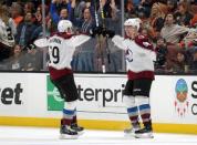 November 18, 2018; Anaheim, CA, USA; Colorado Avalanche right wing Mikko Rantanen (96) celebrates with center Nathan MacKinnon (29) his game winning goal scored against the Anaheim Ducks during the overtime period at Honda Center. MacKinnon provided an assist on the goal. Mandatory Credit: Gary A. Vasquez-USA TODAY Sports