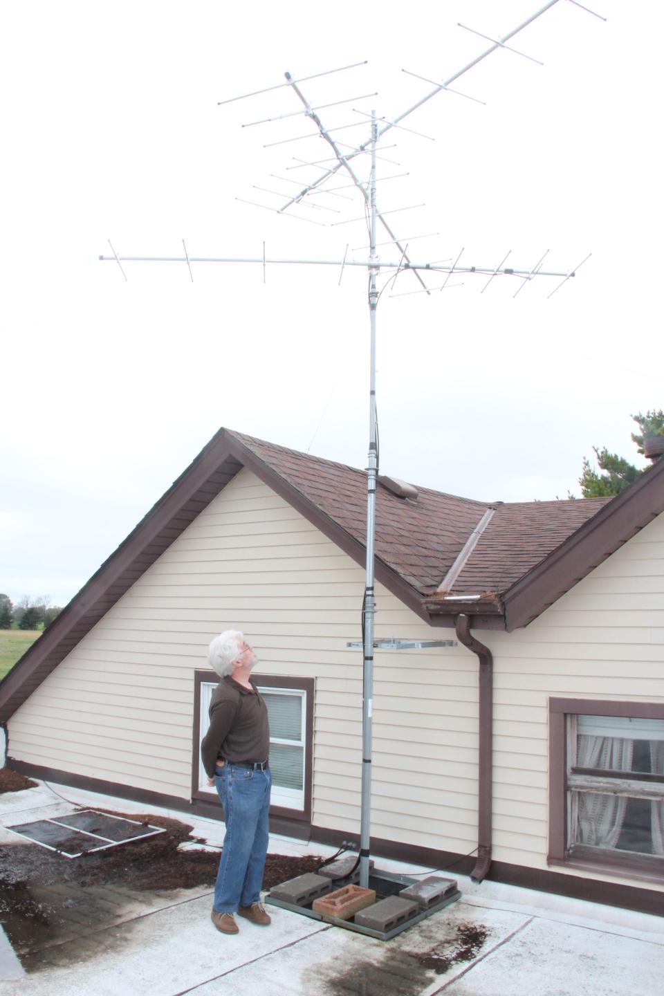 Bill Mueller of Milwaukee inspects a Motus receiver in 2019 on the roof of the Western Great Lakes Bird and Bat Observatory in Port Washington. The Motus project tracks movements of birds fitted with small radio transmitters. The receiver has since been relocated to Afterglow Farm near Port Washington.