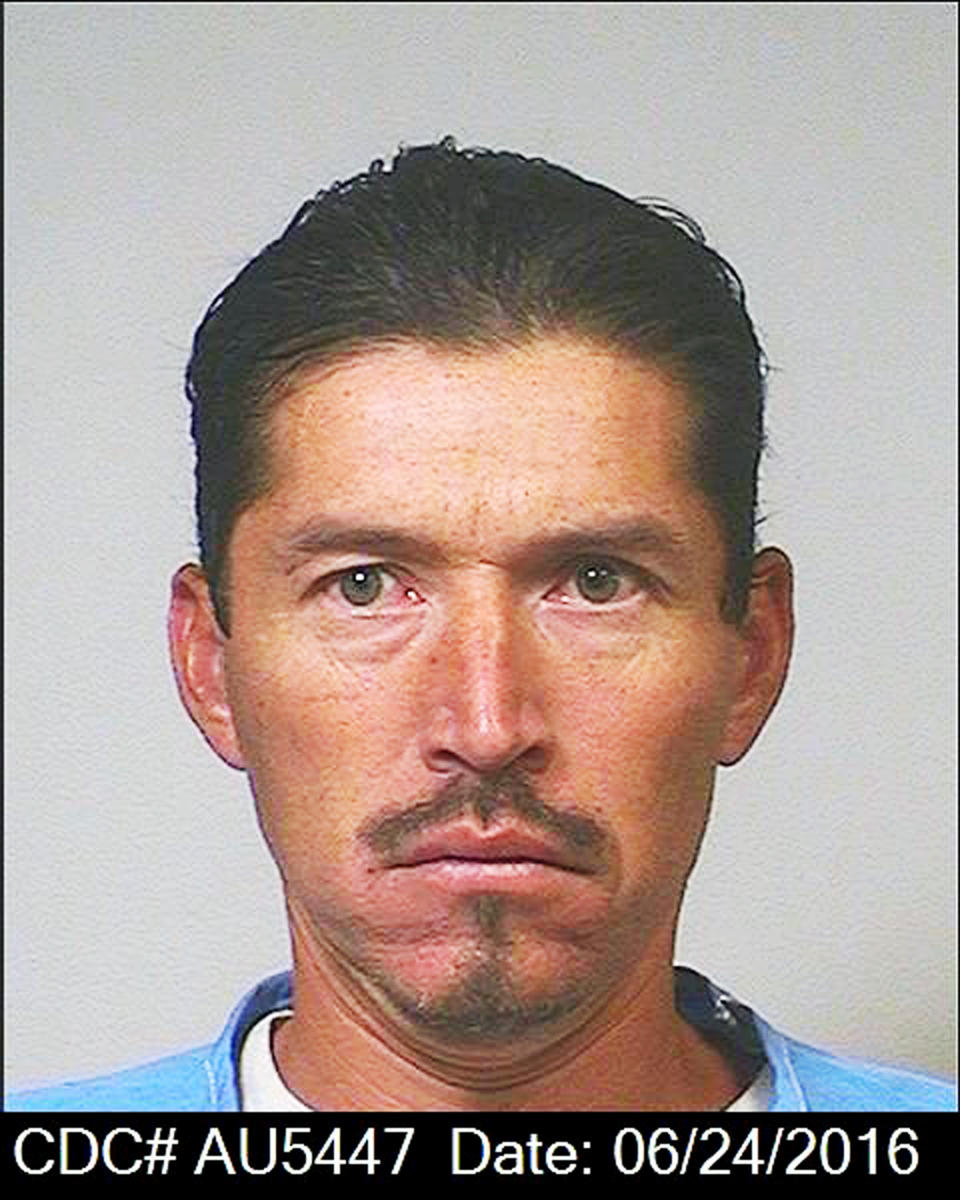 CORRECTS LAST NAME TO RAUDA, NOT ROUDA - This June 24, 2016 photo from the California Department of Corrections and Rehabilitation shows Anthony Rauda. Rauda, an ex-convict, has been charged with killing a father who was camping with his daughters in a Southern California park, and trying to kill the girls and eight other campers and drivers since 2016, prosecutors said Monday, Jan. 7, 2019. (California Department of Corrections and Rehabilitation via AP)