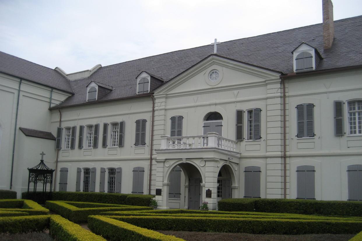 Old Ursulines Convent complex, French Quarter, New Orleans. Exterior view within complex walls on Chartres Street side.