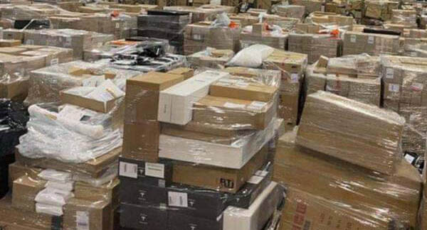 A shocking photo of an Australia Post distribution centre in Melbourne reveals the enormous backlog of parcels waiting to be delivered. Source: 3AW
