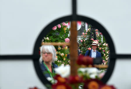 Visitors view floral displays at the RHS Chelsea Flower Show in London, Britain, May 21, 2018. REUTERS/Toby Melville
