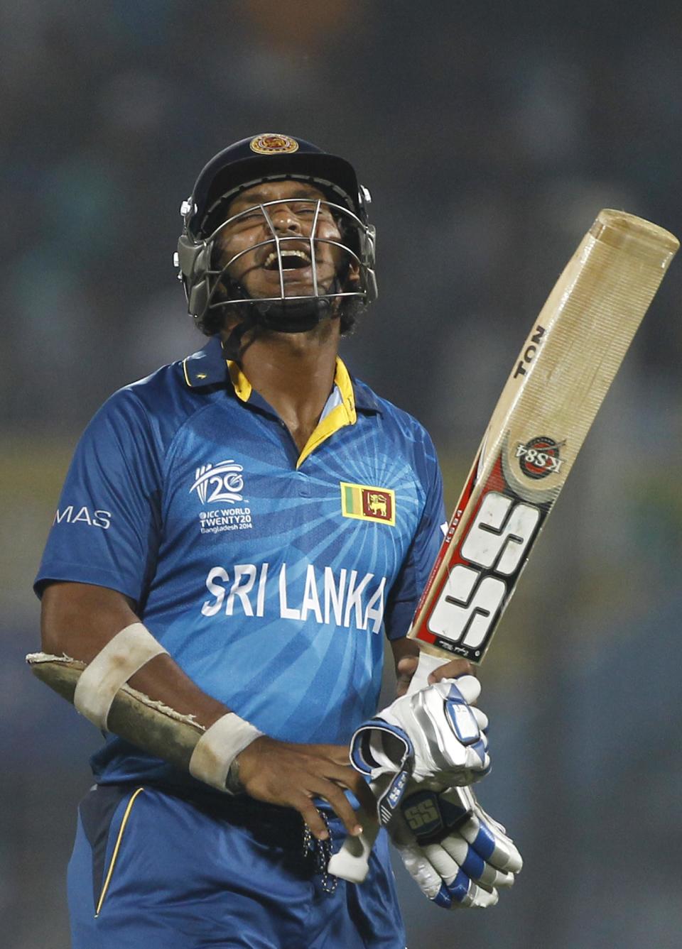Sri Lanka's Kumar Sangakkara reacts as he walks back to the pavilion after his dismissal by New Zealand's Trent Boult during their ICC Twenty20 Cricket World Cup match in Chittagong, Bangladesh, Monday, March 31, 2014. (AP Photo/A.M. Ahad)