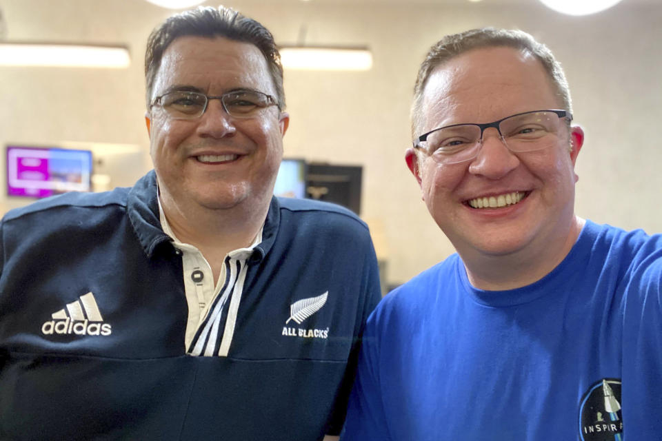 This selfie photo provided by Chris Sembroski shows him, right, with Kyle Hippchen on April 21, 2021. Hippchen says Sembroski is the one person “who lives and breathes” space stuff like he does. (Chris Sembroski via AP)