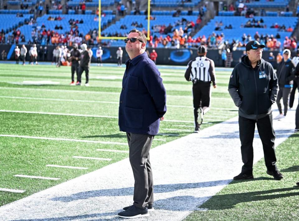 Carolina Panthers general manager Scott Fitterer stands along the team’s sideline during pregame activities at Bank of America Stadium in Charlotte, NC on Sunday, January 7, 2024. The Tampa Bay Buccaneers defeated the Panthers 9-0. At right is team owner David Tepper. Fitterer was fired by after three seasons on Monday, January 8, 2024.