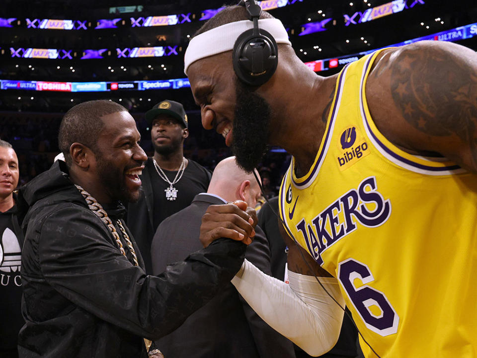 LeBron James #6 of the Los Angeles Lakers celebrates with boxer Floyd Mayweather Jr. at the end of the game after passing Kareem Abdul-Jabbar to become the NBA's all-time leading scorer, surpassing Abdul-Jabbar's career total of 38,387 points against the Oklahoma City Thunder at Crypto.com Arena on February 07, 2023 in Los Angeles, California.