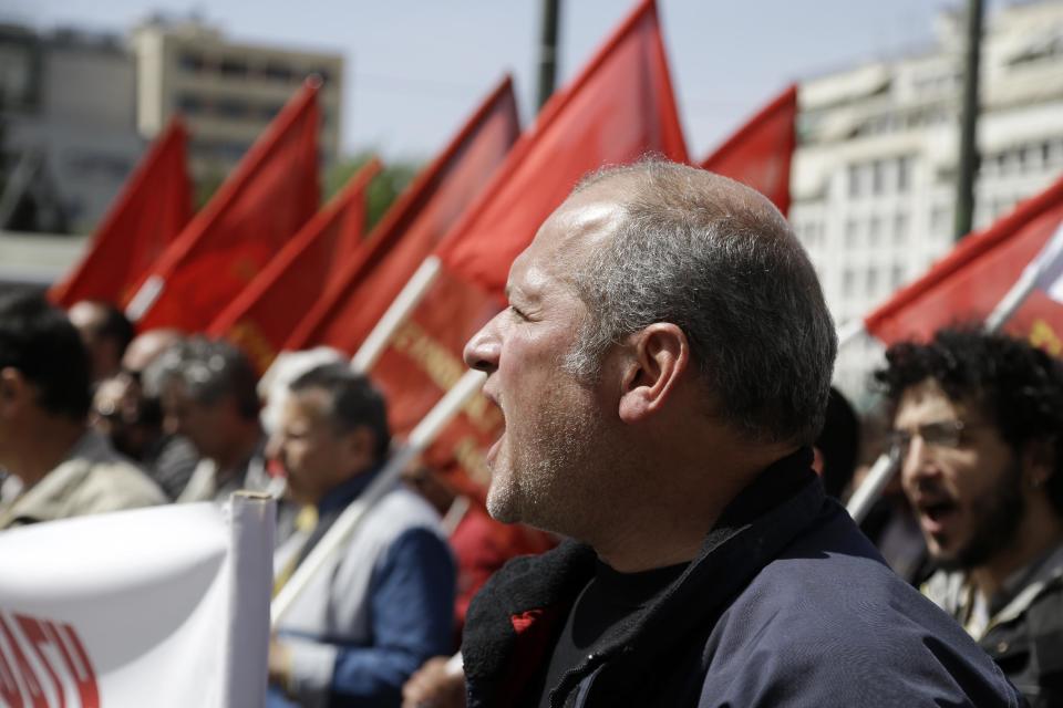 Protesters shout slogans during a rally against unemployment and austerity measures in Athens, on Thursday, March 27, 2014. After a deep recession that started in 2008 , Greece is widely predicted to start growing, albeit modestly, but the ground to be made up is huge, with the Greek economy nearly a quarter smaller than it was and unemployment at more than 27 percent. The crisis has also seen hundreds of thousands of Greeks lose their state-backed health insurance, as most benefits expire after a year of unemployment. (AP Photo/Thanassis Stavrakis)