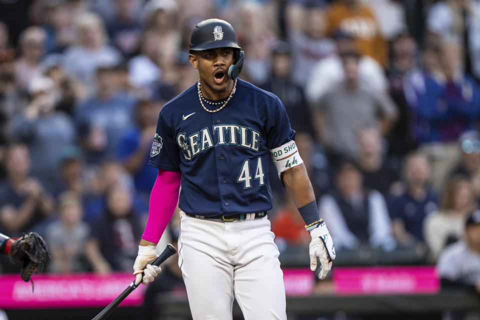 Seattle Mariners' Julio Rodriguez reacts after earning a bases-loaded walk against Minnesota Twins starting pitcher Sonny Gray during the fifth inning of a baseball game, Monday, July 17, 2023, in Seattle. (AP Photo/Stephen Brashear)
