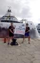 In this frame from video provided by Karen Killeen, protesters demonstrate in front of a super yacht belonging to Walmart heir Nancy Walton Laurie after spray paining it in Ibiza, Spain on July 16, 2023. Climate activists have spraypainted a superyacht, blocked private jets from taking off and plugged holes in golf courses this summer as part of an intensifying campaign against the emissions-spewing lifestyles of the ultrawealthy. (Karen Killeen via AP)