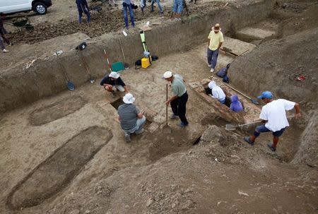 Archaeologists work at the Viminacium site, around 100km east from Belgrade, Serbia August 8, 2016. Picture taken August 8, 2016. REUTERS/Djordje Kojadinovic