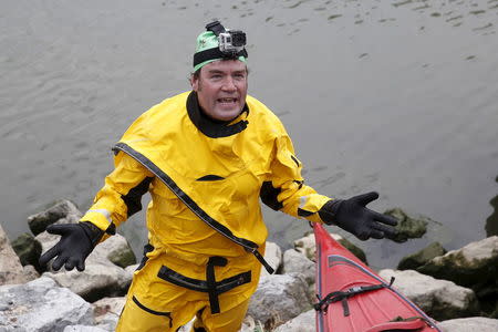 Christopher Swain, a clean-water activist, speaks to the media after swimming in the Gowanus Canal as part of an Earth Day awareness action about pollution in the Brooklyn borough of New York April 22, 2015. REUTERS/Shannon Stapleton