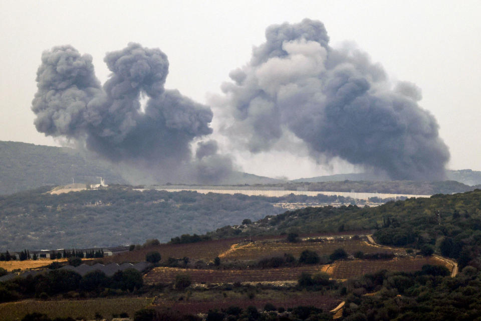 This photo taken from a position along the border in northern Israel on Dec. 27, 2023 shows smoke billowing in the southern Lebanese village of Marwahin following Israeli bombardment amid ongoing cross-border tensions. / Credit: JALAA MAREY/AFP via Getty Images