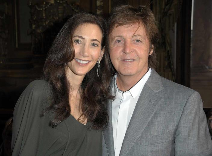 Sir Paul McCartney and Nancy Shevell attend the Stella McCartney Ready to Wear Spring/Summer 2011 show during Paris Fashion Week on October 4, 2010 in Paris, France