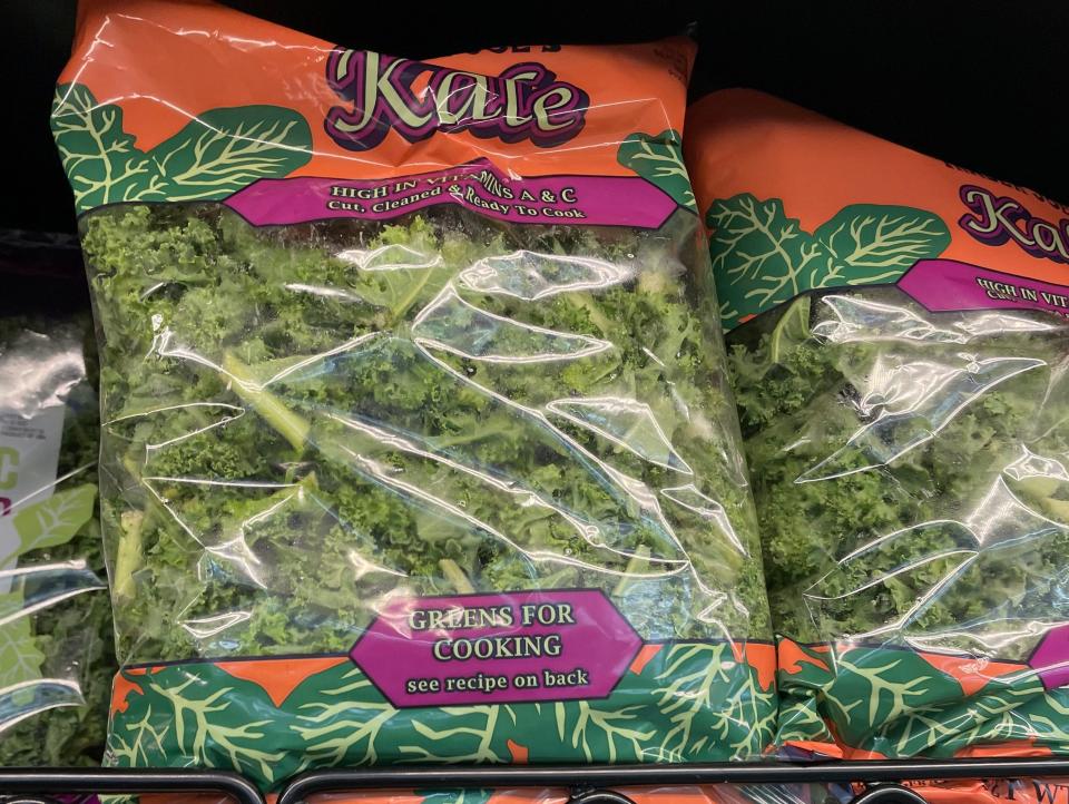 bag of kale on shelves at trader joes