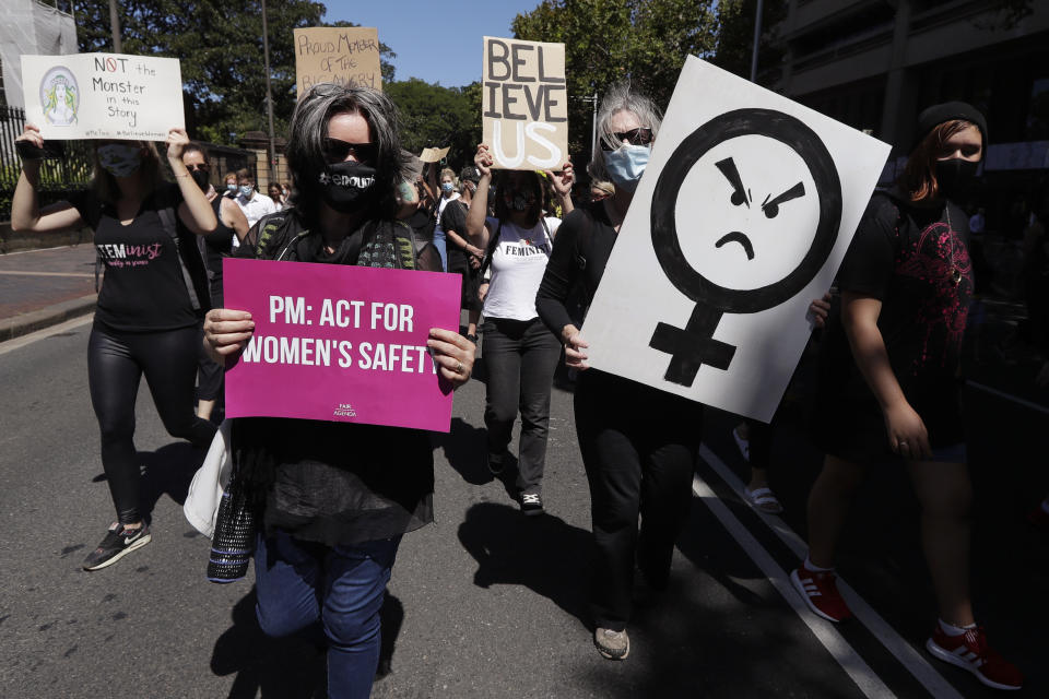 Thousands of people with placards and banners rally demanding justice for women in Sydney, Monday, March 15, 2021, as the government reels from two separate allegations. The rally was one of several across Australia including in Canberra, Melbourne, Brisbane and Hobart calling out sexism, misogyny and dangerous workplace cultures. (AP Photo/Rick Rycroft)