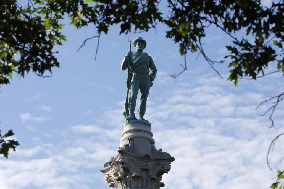 FILE - In this July 8, 2020, file photo, The Confederate Soldiers & Sailors Monument is viewed in Libby Hill Park in Richmond, Va. In a state where Confederate monuments have stood for more than a century and have recently become a flashpoint in the national debate over racial injustice, Virginians remain about evenly divided on whether the statues should stay or go, according to a new poll. The poll conducted this month by Hampton University and The Associated Press-NORC Center for Public Affairs Research found that 46% support removal of Confederate statues and 42% oppose removal. (AP Photo/Steve Helber, File)