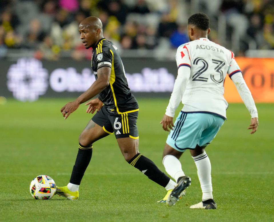 March 9, 2024; Columbus, Ohio, USA; 
Columbus Crew midfielder Darlington Nagbe (6) is defended by Chicago Fire midfielder Kellyn Acosta (23) during the first half of a soccer match Saturday at Lower.com Field.