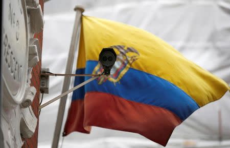 A national flag flies behind a security camera outside the Ecuadorian Embassy where WikiLeaks founder Julian Assange is taking refuge, in London, Britain September 16, 2016. REUTERS/Peter Nicholls