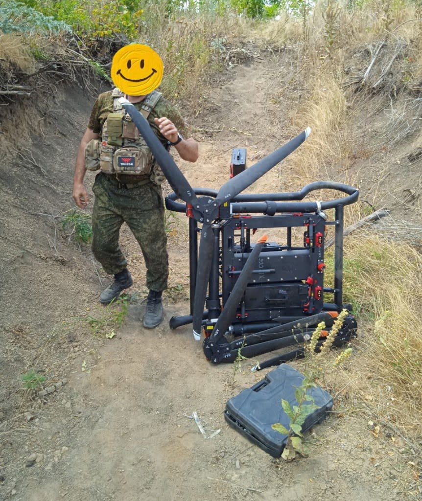 The Baba Yaga in folded configuration next to a Russian soldier. (via Telegram)