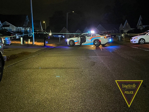 Crime scene tape and police vehicles blocks a portion of Broadmore Drive near where a man was shot and killed late Tuesday, Nov. 21, 2023.