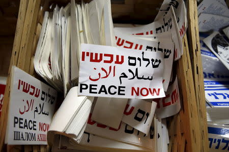 Stickers bearing the logo of Peace Now, an Israeli NGO that tracks and opposes Jewish settlement in the occupied West Bank and East Jerusalem, are seen at their offices in Tel Aviv January 31, 2016. Picture taken January 31, 2016. REUTERS/Baz Ratner