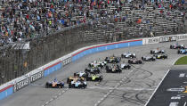FILE - In this June 8, 2019, file photo, drivers jockey for position at the start of an IndyCar auto race at Texas Motor Speedway in Fort Worth, Texas. IndyCar is getting ready for an all-in-one-day season opener on the fast track in Texas, more than 2 ½ months after drivers were set to roll on the streets of St. Pete. The pandemic-delayed season is now set to open Saturday, June 6, 2020. (AP Photo/Larry Papke, File)