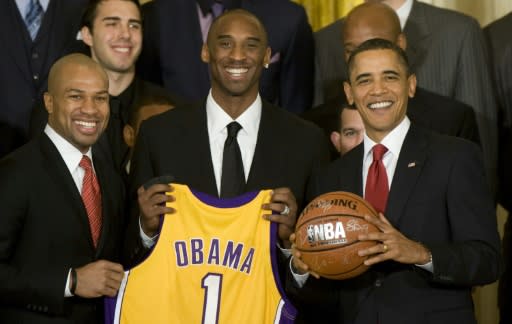 In this file photo taken on January 25, 2010 US President Barack Obama poses with Los Angeles Lakers' Derek Fisher and Kobe Bryant