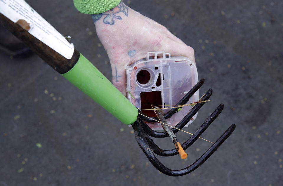 <p>A discarded hypodermic needle retrieved from a boom filled with waste collected on the Merrimack River in Chelmsford, Mass. In Portland, Maine, officials have collected more than 700 needles so far this year, putting them on track to handily exceed the nearly 900 gathered in all of 2016. In March alone, San Francisco collected more than 13,000 syringes, compared with only about 2,900 the same month in 2016. (Photo: Charles Krupa/AP) </p>