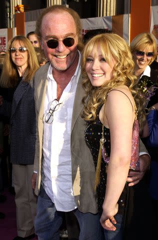 <p>L. Cohen/WireImage</p> Rogow and Duff at the premiere of "The Lizzie Maguire Movie" in 2003.