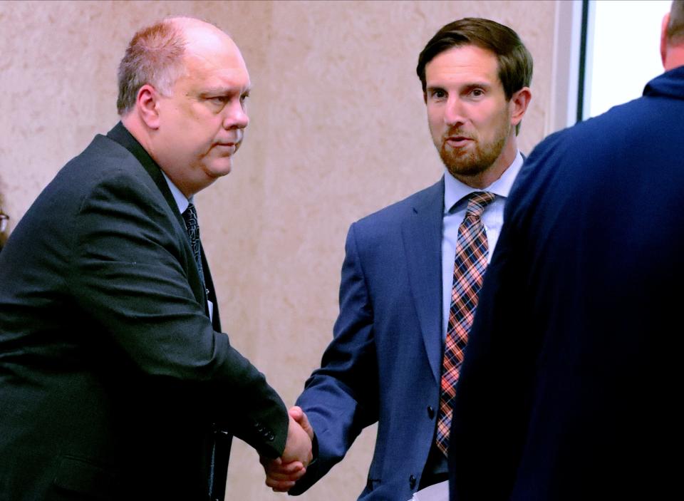 Central Magnet School's principal and Rutherford County Director of Schools candidate John Ash left shakes the hand of James Sullivan after a Rutherford County School Board meeting on Monday, May 23, 2022, where the board voted to appoint Sullivan as the next Rutherford County Schools Director.