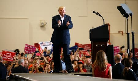 U.S. President Donald Trump acknowledges supporters during a "Make America Great Again" rally at Orlando Melbourne International Airport in Melbourne, Florida, U.S. February 18, 2017. REUTERS/Kevin Lamarque