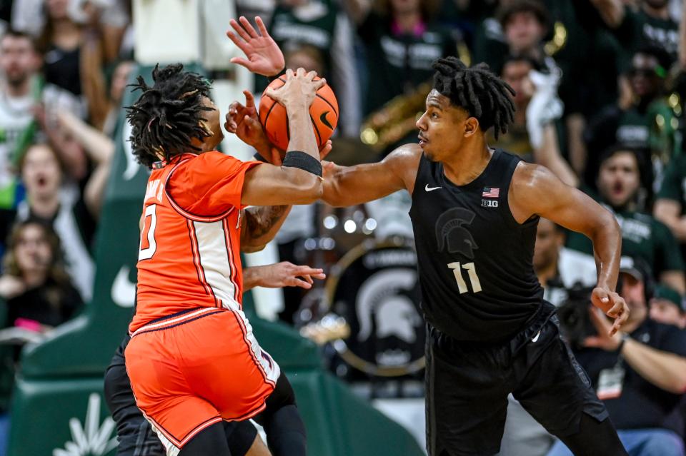 Michigan State's A.J. Hoggard, right, pressures Illinois' Terrence Shannon Jr. during the second half on Saturday, Feb. 10, 2024, at the Breslin Center in East Lansing.