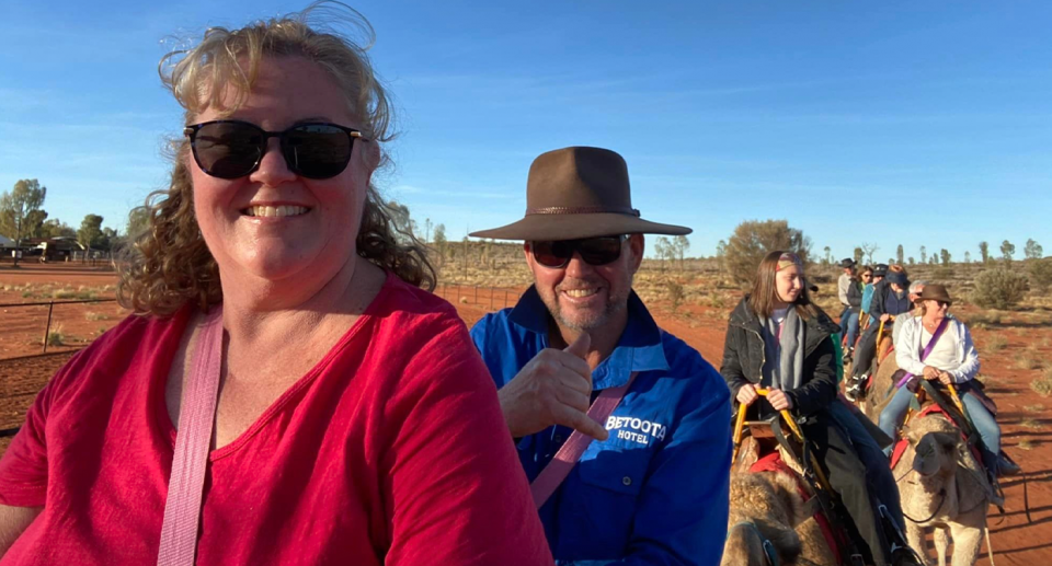 Bernie and Katrina riding camels in the outback. 